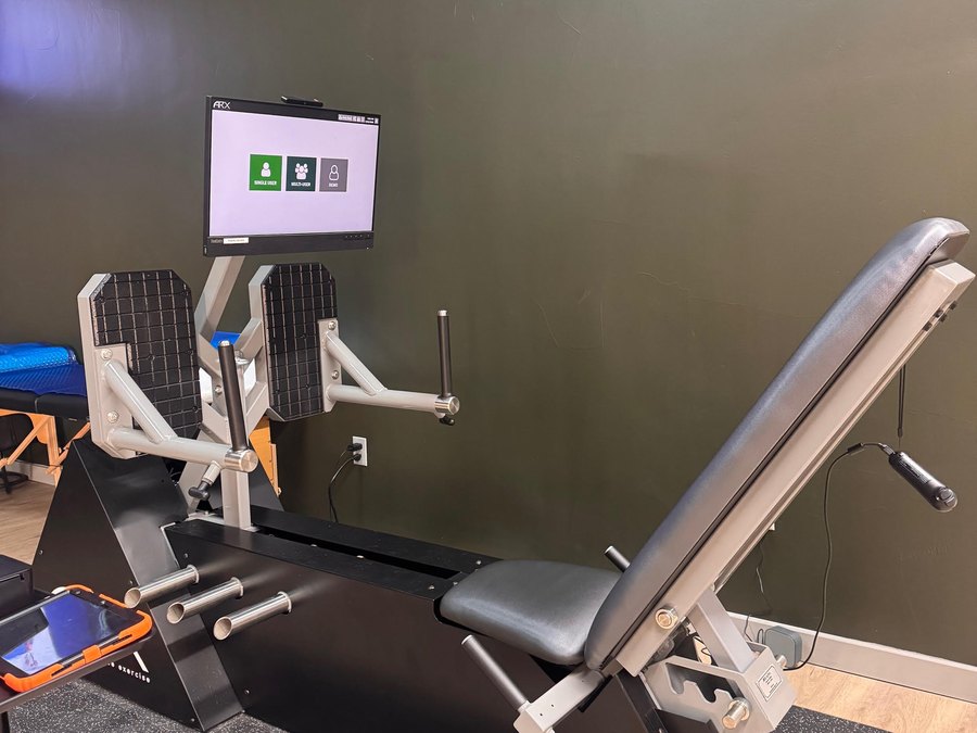 The ARX adaptive resistance machine at WLF Club, its touchscreen showing the user menu.